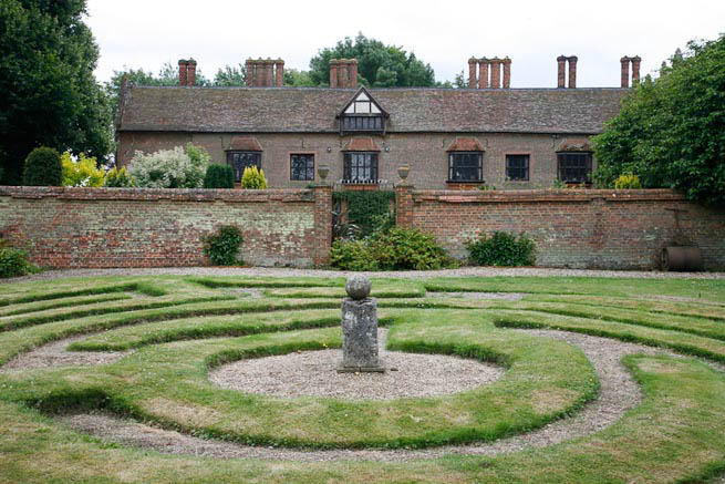 Gardens of a Tudor Manor house divided into compartments with different colour themes and structural forms.