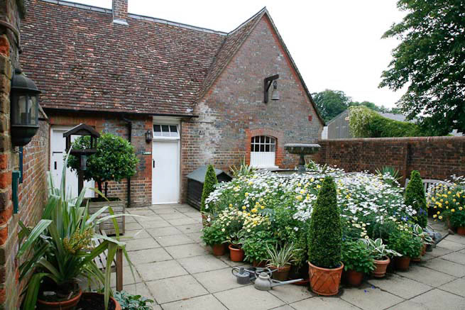 Gardens of a Tudor Manor house divided into compartments with different colour themes and structural forms.