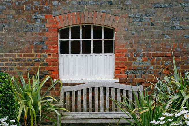 Gardens of a Tudor Manor house divided into compartments with different colour themes and structural forms.