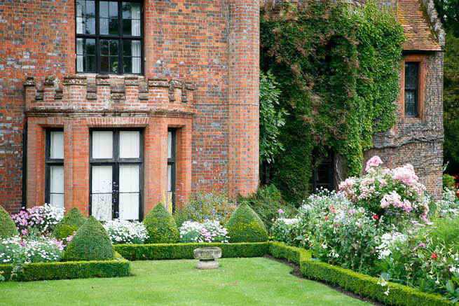 Gardens of a Tudor Manor house divided into compartments with different colour themes and structural forms.