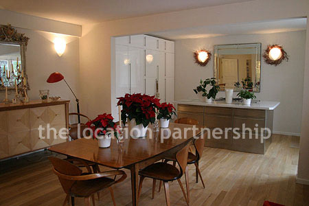 Spacious modern kitchen with island in large ground floor flat.