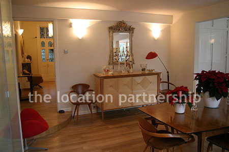 Spacious modern kitchen with island in large ground floor flat.