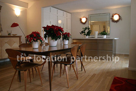 Spacious modern kitchen with island in large ground floor flat.
