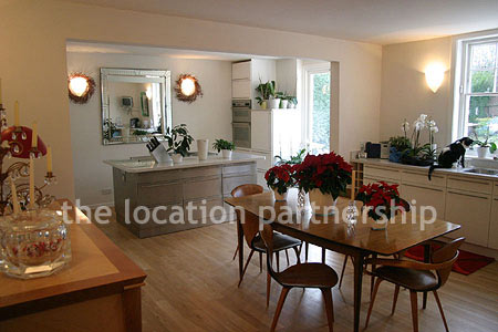 Spacious modern kitchen with island in large ground floor flat.