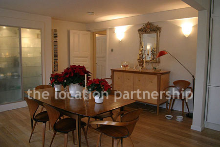 Spacious modern kitchen with island in large ground floor flat.