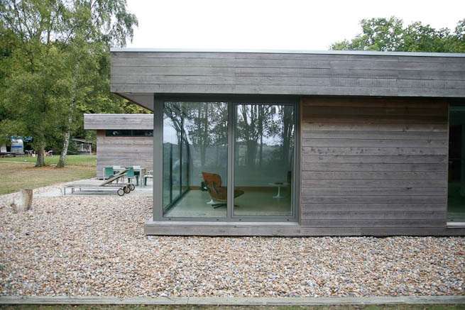 Large sitting room in contemporary country home. Large windows facing onto gardens and lots of natural light.