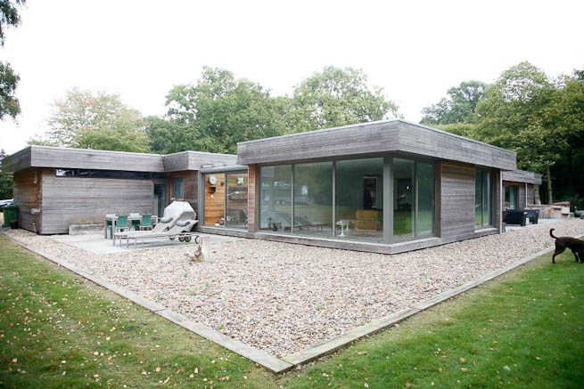 Large sitting room in contemporary country home. Large windows facing onto gardens and lots of natural light.