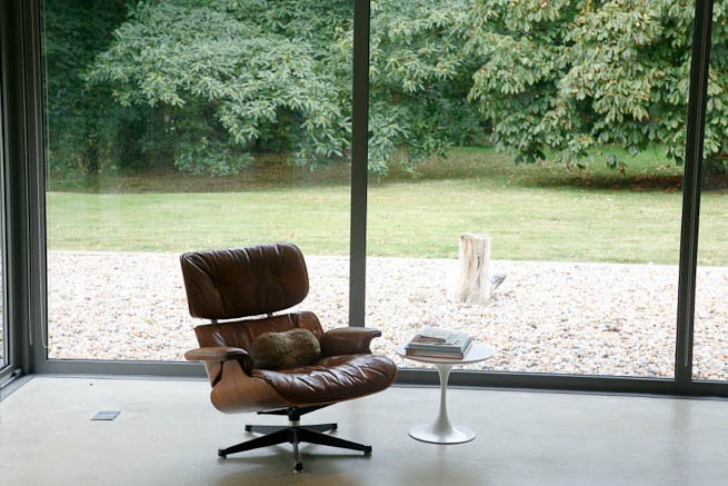Large sitting room in contemporary country home. Large windows facing onto gardens and lots of natural light.
