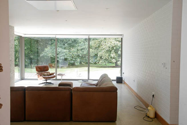 Large sitting room in contemporary country home. Large windows facing onto gardens and lots of natural light.