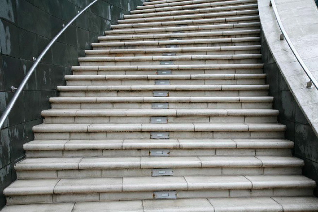 Graphic modern steps with tall slate walls.