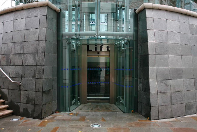 Graphic modern steps with tall slate walls.