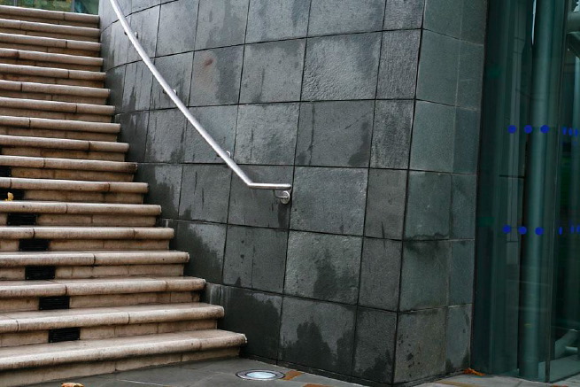 Graphic modern steps with tall slate walls.