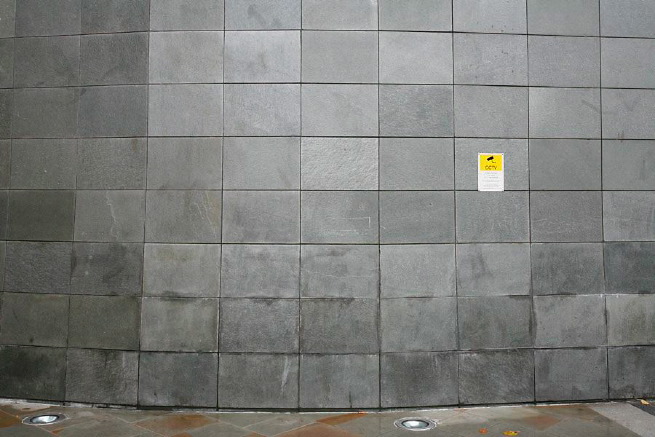 Graphic modern steps with tall slate walls.
