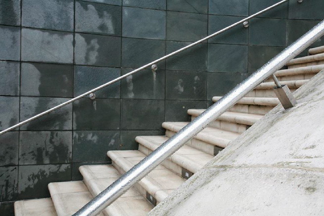 Graphic modern steps with tall slate walls.