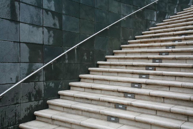 Graphic modern steps with tall slate walls.