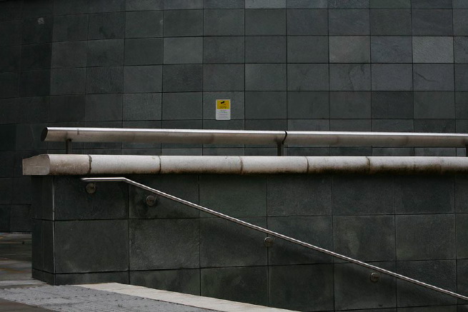 Graphic modern steps with tall slate walls.