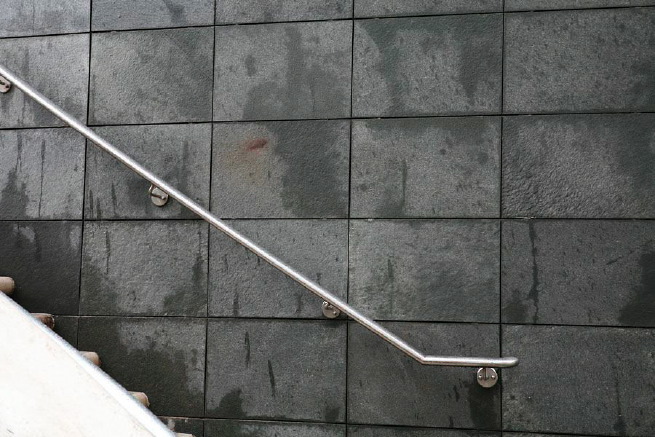 Graphic modern steps with tall slate walls.