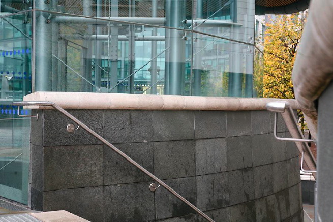 Graphic modern steps with tall slate walls.