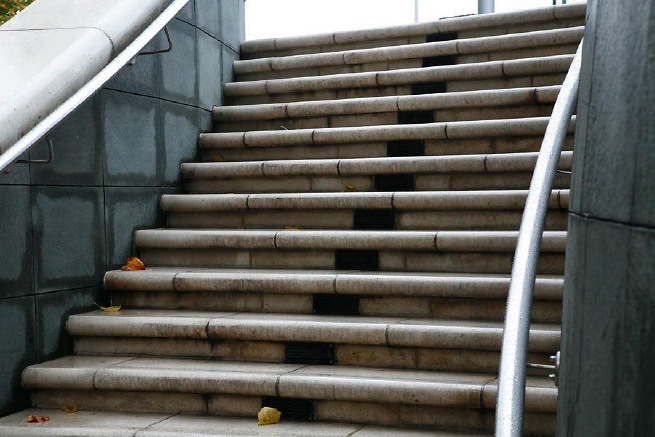 Graphic modern steps with tall slate walls.