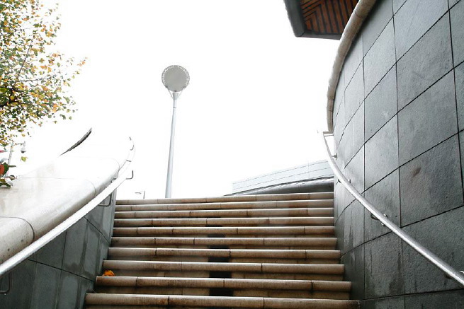 Graphic modern steps with tall slate walls.
