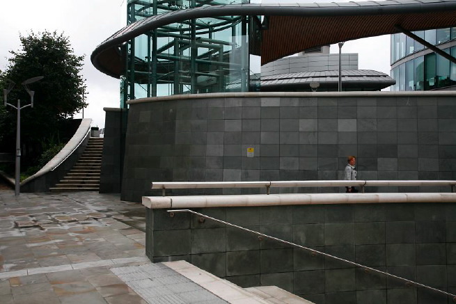 Graphic modern steps with tall slate walls.