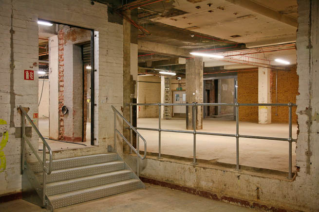 Fantastic basement warehouse events space with amazing variety of textures and full vehicle access.